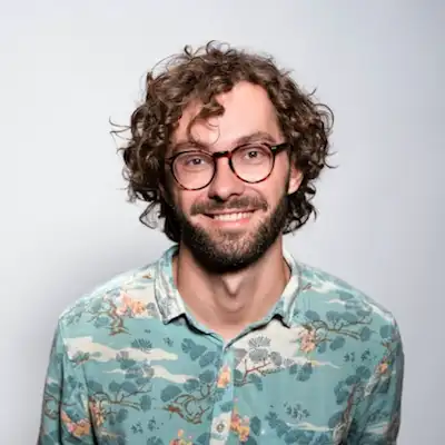 Original reference image 1 for: Pixar-style 3D avatar of the subject smiling against a clean white studio background